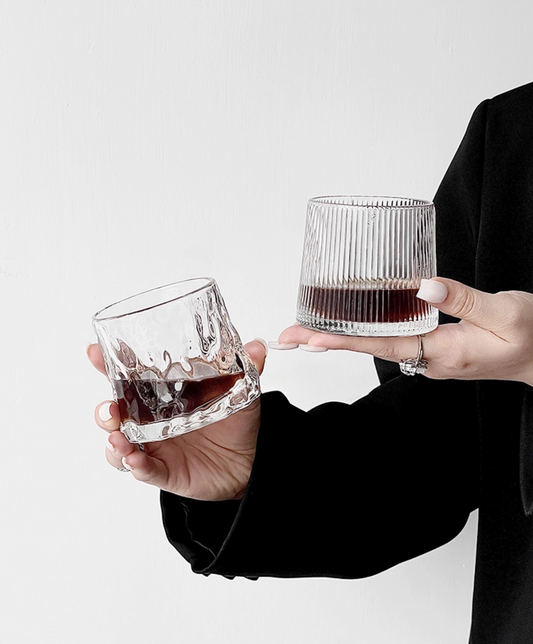 Hand holding Simple Palette Drinking Glass – Grid, showing scale and grip