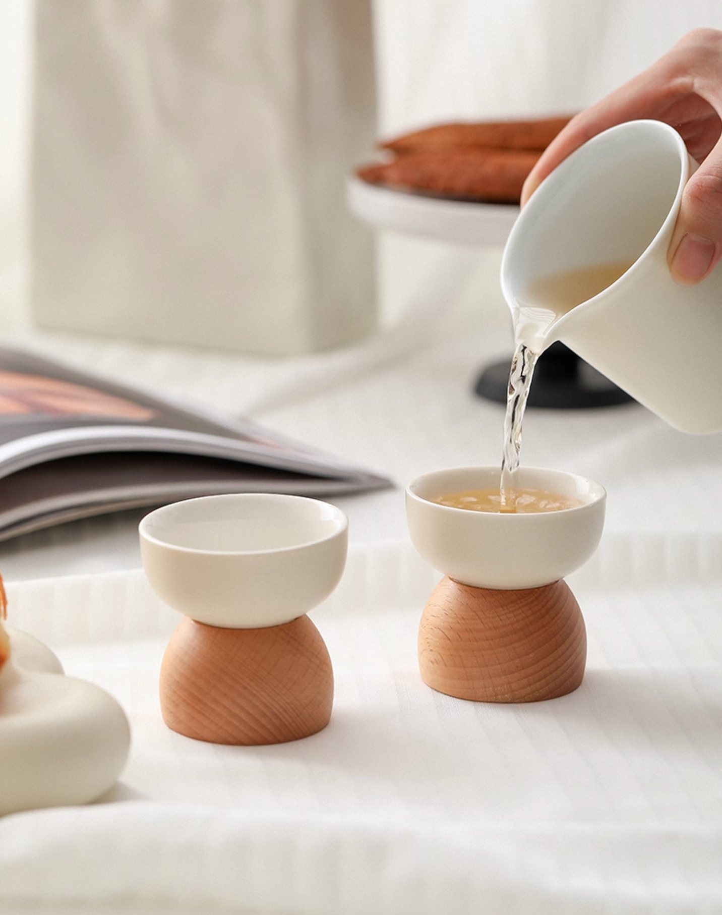 Side profile view of handcrafted Wabi Sabi tea cup showing elegant proportions and handle