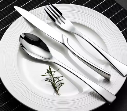 Stainless steel cutlery from side angle showing handle ergonomics - handcrafted flatware