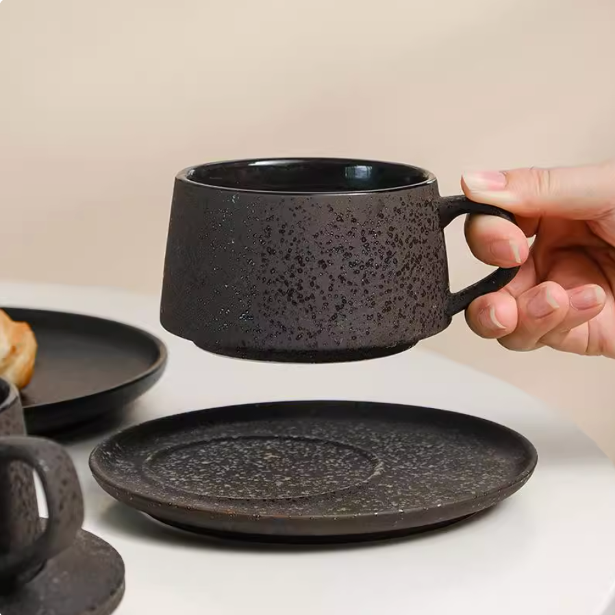Side profile of ceramic coffee cup and saucer showing elegant proportions