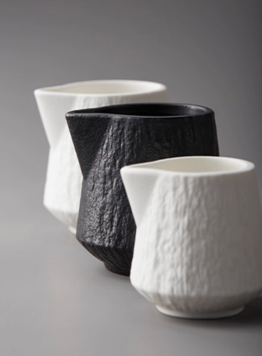 White ceramic creamer and sauce pourer collection - artisanal tableware for hospitality