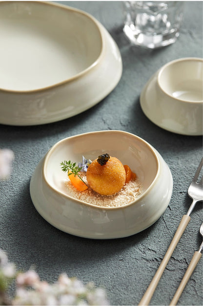 Ceramic deep plate with irregular shape for artistic food presentation